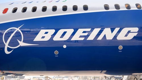 (FILES) This file photo taken on June 18, 2017 shows the Boeing logo on the fuselage of a Boeing 787-10 Dreamliner test plane presented on the Tarmac of Le Bourget. Emirates Airlines on November 12, 2017, agreed to purchase 40 Boeing 787-10 Dreamliners for $15.1 billion, its chief Sheikh Ahmed bin Saeed Al-Maktoum said at the opening of the Dubai Air Show. / AFP PHOTO / ERIC PIERMONTERIC PIERMONT/AFP/Getty Images ORIG FILE ID: AFP_U74PE