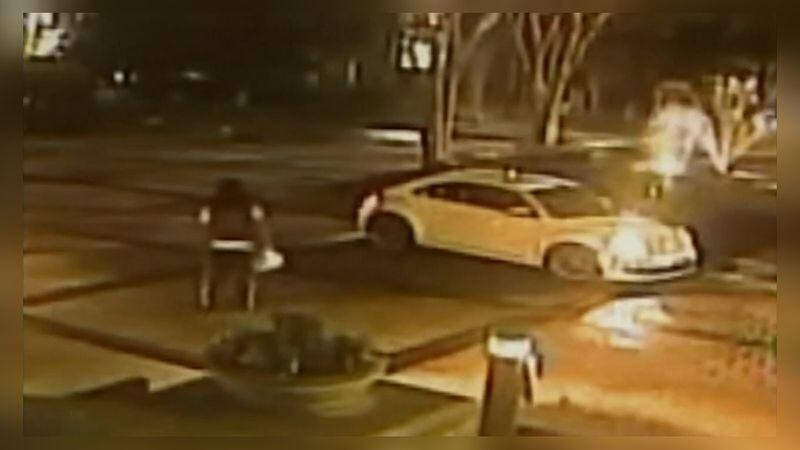 Surveillance footage shows Ryan Thorton walking toward Robert Bivines car the night of the fatal shooting.