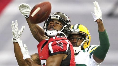 Falcons wide receiver Taylor Gabriel hauls in a long touchdown pass from Matt Ryan past Packers cornerback Demetri Goodson in the Falcons' 33-32 win over Green Bay on Oct. 30, 2016, at the Georgia Dome.