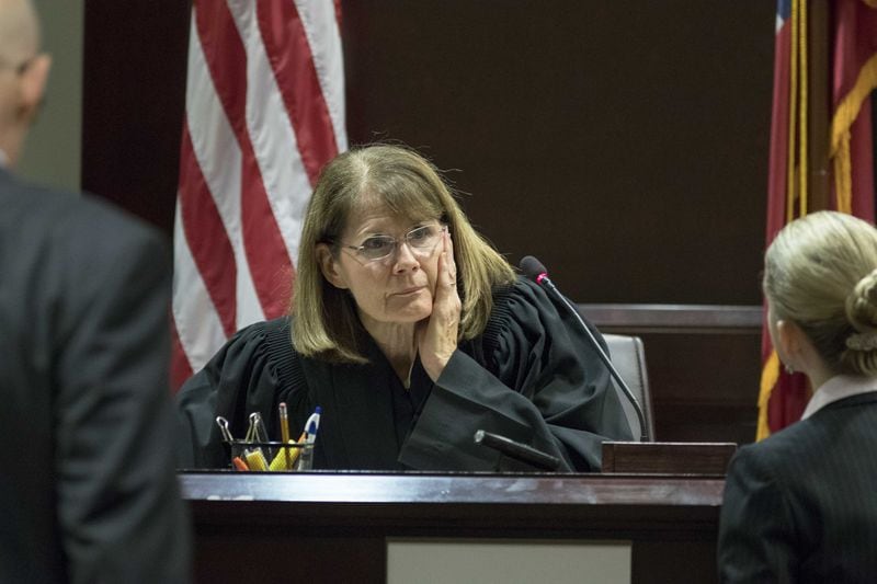 Judge Martha Christian speaks with attorneys during the trial for Nydia Tisdale, who was arrested at a Republican Party function in 2014 as she tried to videotape.