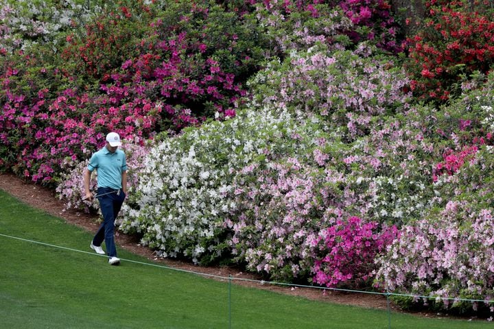 April 9, 2021, Augusta: Jordan Spieth walks past the azaleas on the sixth fairway during the second round of the Masters at Augusta National Golf Club on Friday, April 9, 2021, in Augusta. Curtis Compton/ccompton@ajc.com