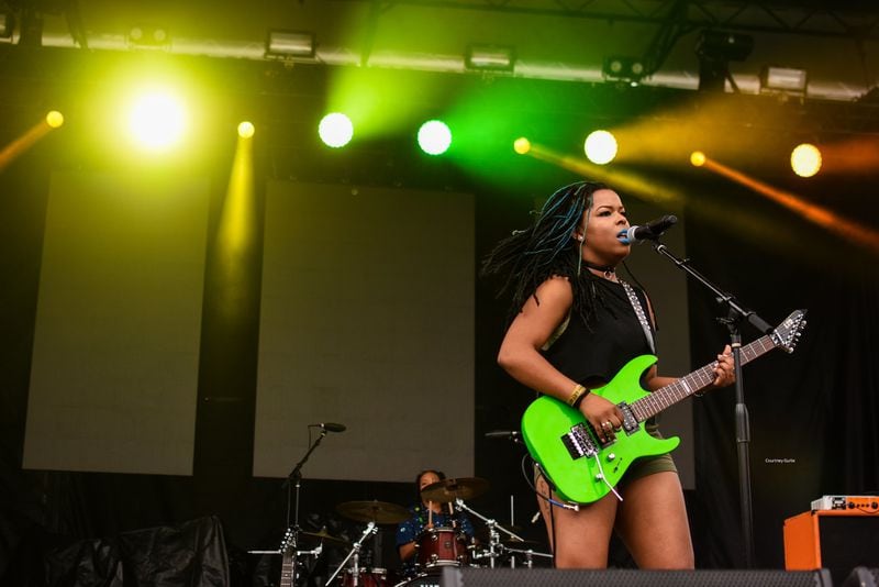 The Txlips’ lead guitarist, Gabriella Logan, rocks the stage at the Afropunk Festival. The Txlips have performed at Afropunk in Atlanta and Brooklyn. They’ve performed at One MusicFest, opened for Grammy Award-winning folk rockers the Indigo Girls and headlined on their own tour. CONTRIBUTED BY COURTNEY GURLIE