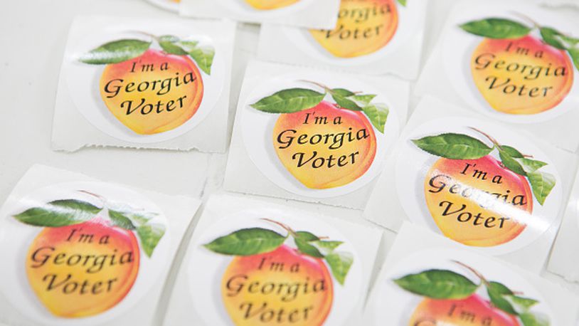 ATLANTA, GA - NOVEMBER 4:  Georgia voter stickers are displayed for voters in the midterm election at Grady High School on November 4, 2014 in Atlanta, Georgia.  Georgia Democratic U.S. Senate candidate Michelle Nunn is running in a tight race against Republican U.S. Senate candidate David Perdue.  (Photo by Jessica McGowan/Getty Images)