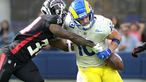 Rams receiver Cooper Kupp has the ball punched out of his arms by Falcons cornerback Darren Hall late in the fourth quarter at SoFi Stadium on Sunday. The Falcons recovered the ball. (Wally Skalij/Los Angeles Times/TNS)