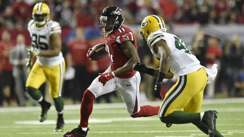 January 22, 2017, Atlanta - Falcons wide receiver Julio Jones (11) runs with the ball during the NFC Championship game against the Packers in Atlanta, Georgia, on Sunday, January 22, 2017. (DAVID BARNES / DAVID.BARNES@AJC.COM)