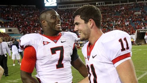 Georgia tight end Orson Charles ( left) and quarterback Aaron Murray celebrate their 24-20 win over Florida Oct. 29, 2011, at EverBank Field in Jacksonville, Fla.