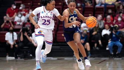 Georgia Tech guard Eylia Love (24) brings the ball up as Kansas guard Chandler Prater (25) defends during the first half of a first-round game in the NCAA women's college basketball tournament Friday, March 18, 2022, in Stanford, Calif. (AP Photo/Tony Avelar)