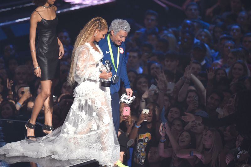 Jimmy Fallon (as Ryan Lochte) escorts Video of the Year winner Beyonce offstage at Madison Square Garden. The king and the queen of the prom? (Photo by Michael Loccisano/Getty Images)