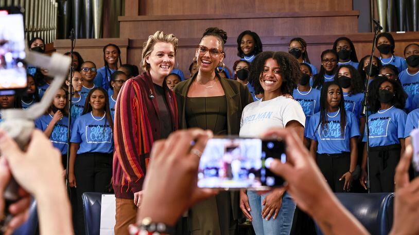 (Left to right) Singers Brandi Carlile, Alicia Keys and Spelman College Student Government Association President Chandler Nutall pose for a photo following a conversation about social justice on Friday, September 23, 2022 at Sisters Chapel. (Natrice Miller/natrice.miller@ajc.com)