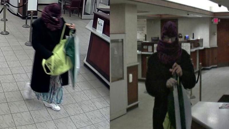 Pittsburgh Police released these photos of a suspected bank robber wearing a dress and a purple hat and scarf  during a heist Thursday morning.