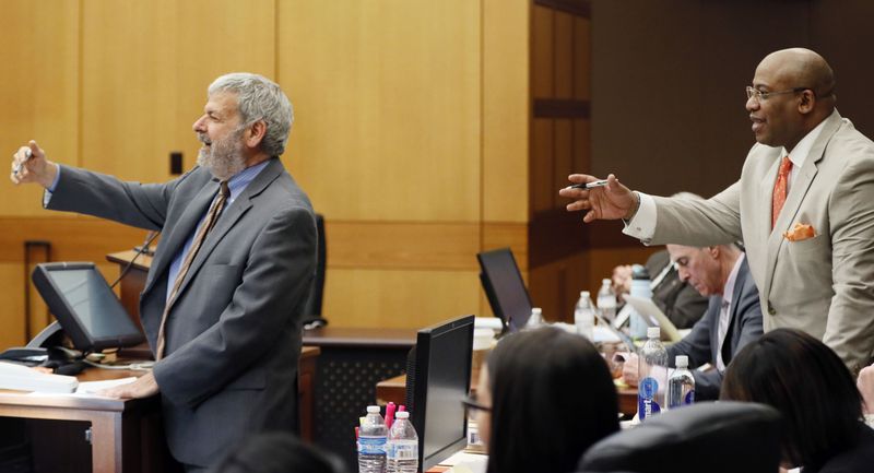 Defense co-counsel Don Samuel (left) and Chief Assistant District Attorney Clint Rucker argue to the judge about Rucker's objections to Samuel's examination of defense witness Annie Anderson during the Tex McIver murder trial at the Fulton County Courthouse on Thursday, April 12, 2018. (Bob Andres bandres@ajc.com)