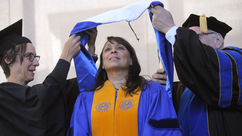 Former U.S. Poet Laureate Natasha Tretheway receives an honorary degree before her keynote address at Emory University's 2017 commencement.