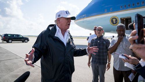 President Donald Trump talks to reporters as he arrives in Ft. Myers, Fla., Sept. 14, 2017. Trump on Friday used an unfolding terrorist attack in London to revive his push for a travel ban for people from predominantly Muslim countries, an effort that has been hampered by U.S. courts. The proposed restrictions have faced legal challenges and drawn criticism because of concerns that they amount to discrimination based on religion. (Doug Mills/The New York Times)