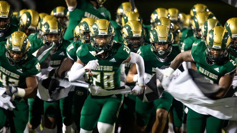 The Grayson Rams take the field during a GHSA high school football game between the Grayson Rams and the Brookwood Broncos at Grayson High School in Loganville, Ga. on Friday, October 22, 2021. (Jenn Finch/Special to the AJC)