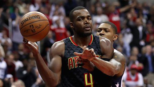 Paul Millsap of the Atlanta Hawks passes the ball in front of Bradley Beal of the Washington Wizards in the second half of Game Two of the Eastern Conference Quarterfinals during the 2017 NBA Playoffs at Verizon Center on April 19, 2017 in Washington, DC. (Photo by Rob Carr/Getty Images)