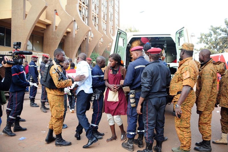 A woman receives care and others are evacuated to a hospital following a terrorist attack on a café and hotel in Ouagadougou, Burkino Faso, on Jan. 16, 2016. Photo by Tiga Remi/Imagespic Agency/Sipa USA