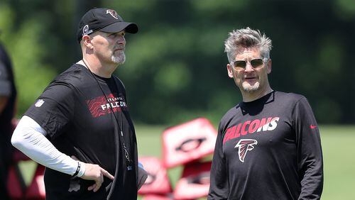 Atlanta Falcons head coach Dan Quinn and general manager Thomas Dimitroff take in the first day of rookie minicamp Friday, May 11, 2018, in Flowery Branch.