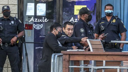 Atlanta police investigate the shooting scene Monday, May 17, 2021, at the Azule Restaurant and Lounge located at 2625 Piedmont Road NE in the Lindbergh area of Buckhead, where a 43-year-old man was found dead in a bathroom. (John Spink / John.Spink@ajc.com)