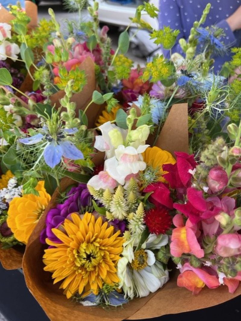Locally grown flowers have become a popular choice at many local farmers markets, such as the Friday evening Lilburn Farmers Market. (Courtesy of Andrea Brannen)