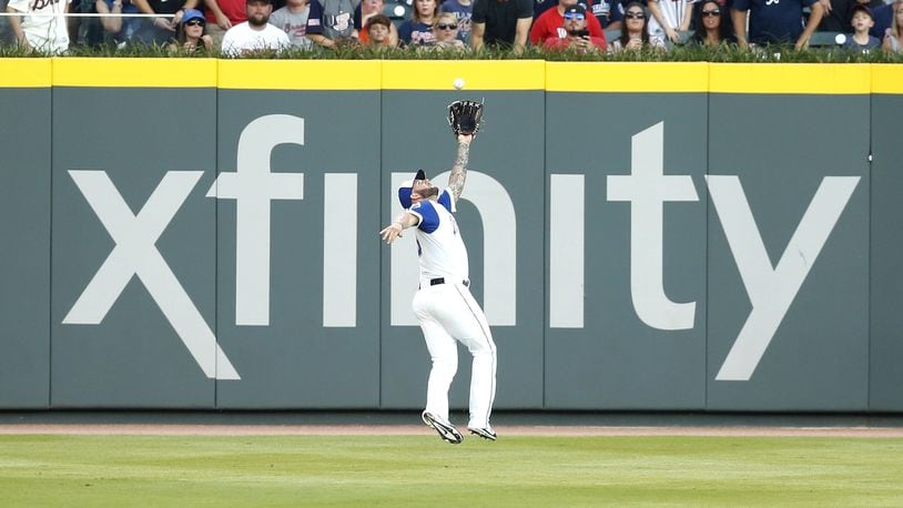 ATLANTA, GA - AUGUST 18: Left fielder Matt Adams #18 of the Atlanta Braves makes a running catch in the first inning during the game against the Cincinnati Reds at SunTrust Park on August 18, 2017 in Atlanta, Georgia. (Photo by Mike Zarrilli/Getty Images)