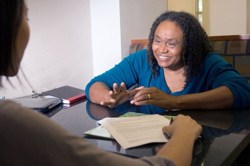 Dr. Toni Miles, shown here working one-on-one with a study participant, says people can die of a broken heart. Miles, a University of Georgia physician epidemiologist, recently conducted a study about the health effects of grief on surviving family and friends. CONTRIBUTED