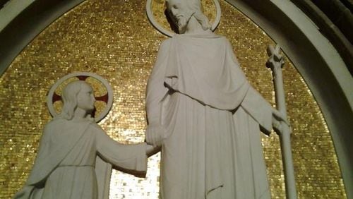 This statue at the Cathedral of Christ the King in Atlanta shows St. Joseph with a young Jesus. Though you don’t find St. Joseph praised in Christmas carols, he was a strong role model. CONTRIBUTED BY LORRAINE MURRAY
