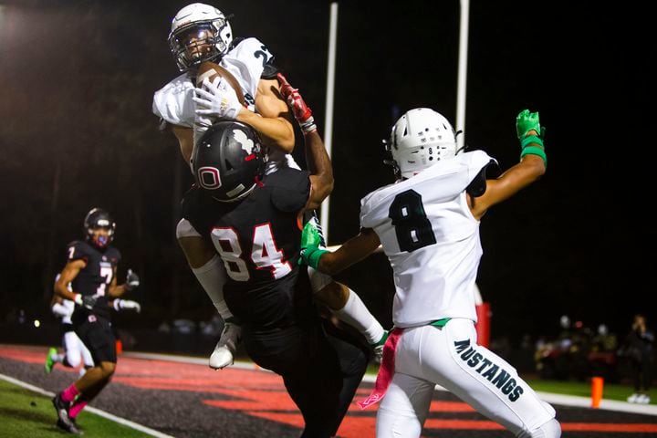 Michael Bell, strong safety for Kennesaw Mountain, makes an interception against Osborne on Friday, October 7, 2022 in Marietta. Kennesaw Mountain defeated Osborne 49-0. CHRISTINA MATACOTTA FOR THE ATLANTA JOURNAL-CONSTITUTION.