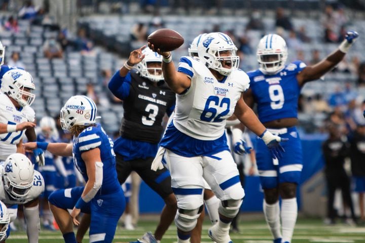 Malik Sumter (62) celebrates during the Georgia State University spring football game on Friday at Center Parc Stadium in Atlanta. The white team defeated the blue team 23-17. CHRISTINA MATACOTTA FOR THE ATLANTA JOURNAL-CONSTITUTION