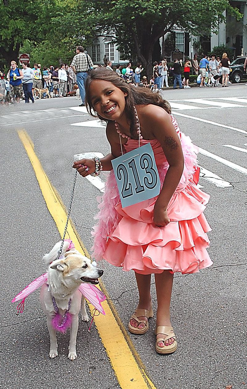 Dogs and their owners dress up in costumes to march in Birmingham’s Do Dah Day parade along historic Highland Avenue in the Southside neighborhood. CONTRIBUTED BY GREATER BIRMINGHAM CONVENTION AND VISITORS BUREAU