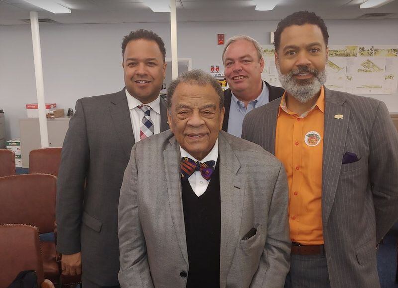 Fort McPherson redevelopment authority director Brian Hooker, right, with developer Stephen Macauley (looking over his shoulder) during happier times. Also pictured are former Mayor Andrew Young and authority chair Cassius Butts. Photo from LRA website