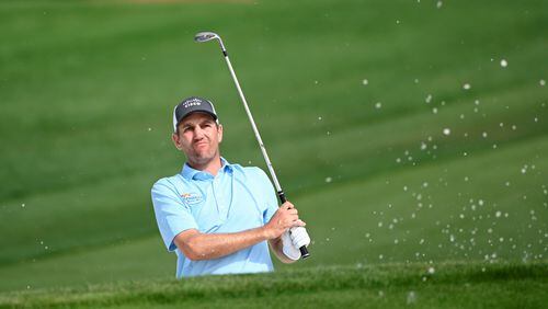 Brendon Todd watches his shot after hitting from a bunker onto the ninth green during the first round of the Arnold Palmer Invitational golf tournament, Thursday, March 5, 2020, in Orlando, Fla. (AP Photo/Phelan M. Ebenhack)
