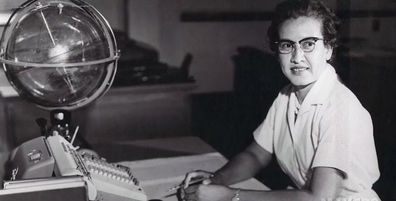 NASA research mathematician Katherine Johnson is photographed at her desk at NASA’s Langley Research Center with a globe, or “Celestial Training Device.” CONTRIBUTED BY NASA