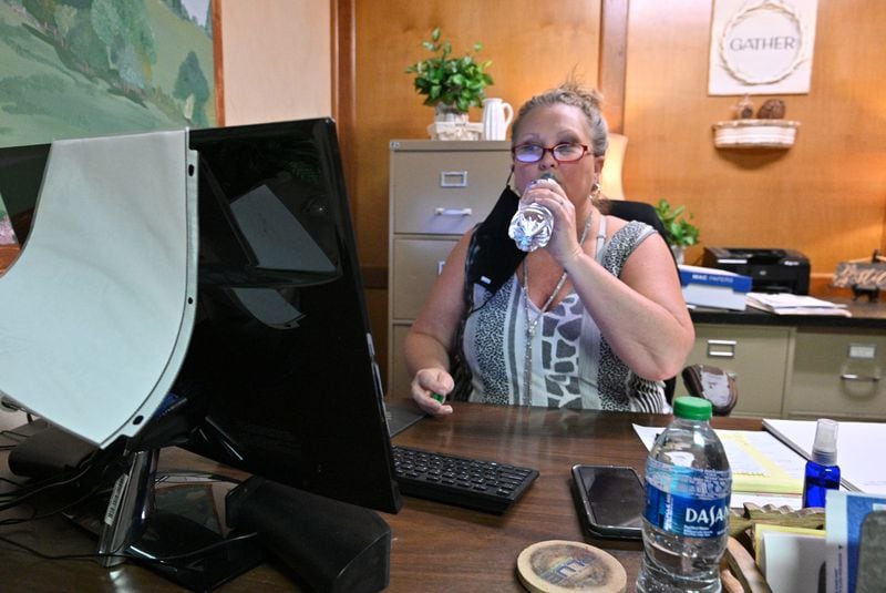May 25, 2022  Snellville - Adrienne Levesque drinks water frequently as a part of her long Covid treatment at her office at Summit Chase Country Club in Snellville on Wednesday, May 25, 2022. Adrienne Levesque has been dealing with long Covid and has had cardiac issues ever since she got sick with COVID in 2020. She has been going to a long Covid clinic and sees a cardiologist. (Hyosub Shin / Hyosub.Shin@ajc.com)