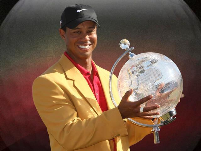 Tiger Woods holds the Australian Masters trophy, Melbourne, Australia in November of 2009.