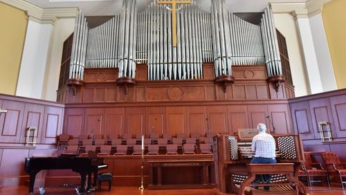 Richard Marchand plays a pipe organ at Johns Creek United Methodist Church that was donated by a Manhattan church that was just blocks away from the World Trade Center when the towers went down. (HYOSUB SHIN / HSHIN@AJC.COM)