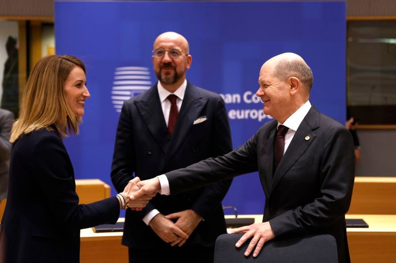 Germany's Chancellor Olaf Scholz, right, speaks with European Parliament President Roberta Metsola, left, and European Council President Charles Michel during a round table meeting at an EU summit in Brussels, Wednesday, April 17, 2024. European leaders' discussions at a summit in Brussels were set to focus on the bloc's competitiveness in the face of increased competition from the United States and China. Tensions in the Middle East and the ongoing war between Russia and Ukraine decided otherwise and the 27 leaders will dedicate Wednesday evening talks to foreign affairs. (AP Photo/Omar Havana)