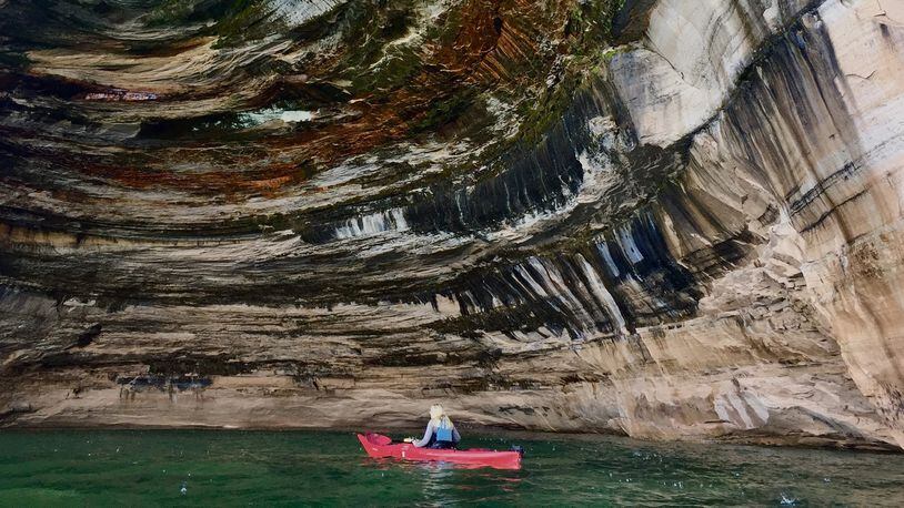 Kayakers paddle along Pictured Rocks National Lakeshore in Michigan, along the south shore of Lake Superior — one of the highlights along the 1,300-mile Lake Superior Circle Tour. (Kelly Smith/Minneapolis Star Tribune/TNS)
