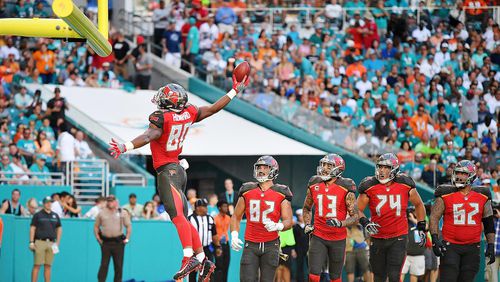 MIAMI GARDENS, FL - NOVEMBER 19:  O.J. Howard #80 of the Tampa Bay Buccaneers celebrates after scoring a touchdown during the second quarter against the Miami Dolphins at Hard Rock Stadium on November 19, 2017 in Miami Gardens, Florida.  (Photo by Mark Brown/Getty Images)