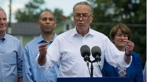 Senate Minority Leader Charles Schumer, D-N.Y., flanked by congressional Democrats, speaks in Berryville, Va., on July 24, 2017, to unveil a new agenda. (AP/Cliff Owen)