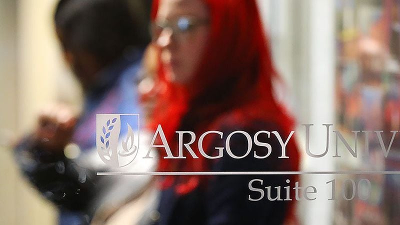 Argosy University students wait inside the Atlanta Campus to find out information on the future of the university on Thursday, March 7, 2019. The school closed for good one day later.