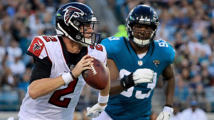 Falcons quarterback Matt Ryan is pressured by Jacksonville's Calais Campbell during a preseason game Aug. 25, 2018, at TIAA Bank Field in Jacksonville, Fla.