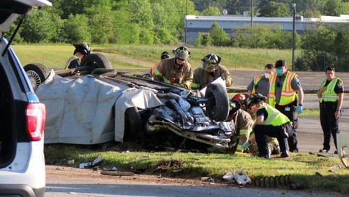 Rome-Floyd County firefighters respond to the scene of a crash that killed a 51-year-old woman and her 18-year-old son Tuesday afternoon.