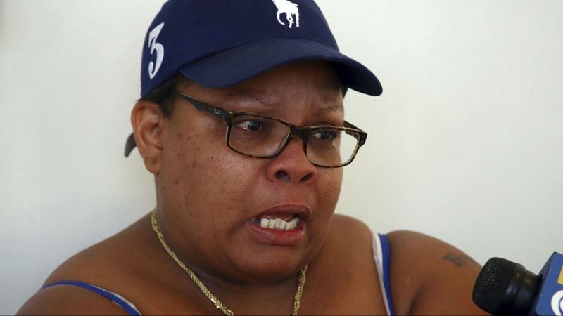 Alicia Grayson, mother of 18-year-old Nia Wilson, who was fatally stabbed at a Bay Area Rapid Transit station, tearfully speaks with reporters outside a courtroom before the arraignment of suspect John Lee Cowell Wednesday, July 25, 2018, in Oakland, California. Wilson's older sister, Lehtifa Wilson, was also stabbed, but survived.