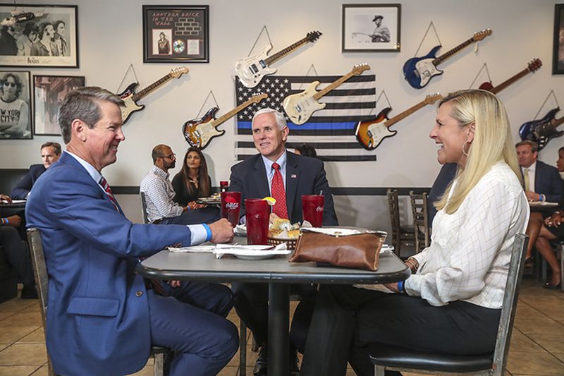 May 22, 2020 Atlanta: Governor Brian Kemp (left) eating lunch with Vice President Pence (center) and first lady Marty Pence (right) at the Star Cafe located at 2053 Marietta Blvd NW in Atlanta on Friday, May 22, 2020. Vice President Mike Pence who visited Atlanta on Friday, May 22, 2020 praised Gov. Brian Kemp and Georgia restaurant owners who have reopened their establishments in recent weeks, lending a high-level dose of support to state leaders who have been criticized for ending pandemic restrictions too soon. Gov. Brian Kemp and Vice President Mike Pence, along with Georgia first lady Marty Kemp, had lunch at the Star Cafe in Atlanta during PenceÃ¢â¬â¢s visit on Friday which also included a roundtable discussion with restaurant executives at the Waffle House Headquarters. JOHN SPINK/JSPINK@AJC.COM