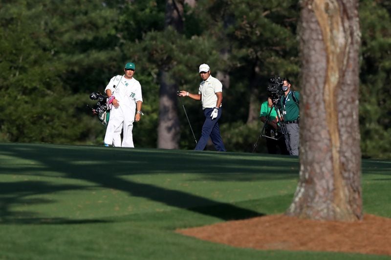Hideki Matsuyama reacts after hitting into the water on the 15th fairway during the final round of the Masters Tournament Sunday, April 11, 2021, at Augusta National Golf Club in Augusta. (Curtis Compton/ccompton@ajc.com)