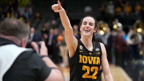 Iowa's Caitlin Clark celebrates after an NCAA Women's Final Four semifinals basketball game against South CarolinaFriday, March 31, 2023, in Dallas. Iowa won 77-73 to advance to the championship on Sunday. (AP Photo/Darron Cummings)