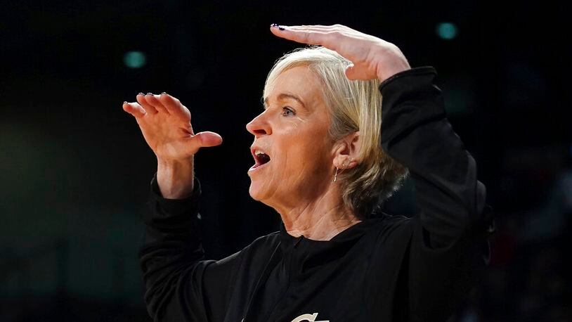 Georgia Tech head coach Nell Fortner signals to her players on the court during the first half of an NCAA college basketball game against Louisville Sunday, Jan. 2, 2022, in Atlanta. (AP Photo/John Bazemore)
