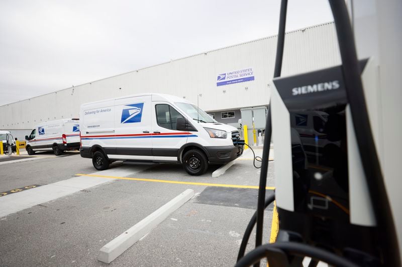 A USPS new electric van is seen charging outside of the South Atlanta S&DC — Post Office during the unveiling of the first of tens of thousands of electric vehicles and charging stations on Monday, January 22, 2024.
Miguel Martinez /miguel.martinezjimenez@ajc.com
