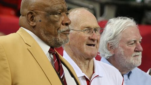 Former Falcon Tommy Nobis (center) is in the company of other franchise greats Claude Humphrey (left) and Jeff Van Note during a 2015 ceremony. ( Curtis Compton / ccompton@ajc.com)