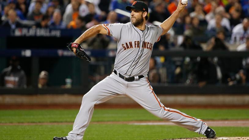 San Francisco Giants starting pitcher Madison Bumgarner (40) delivers against the New York Mets. (AP Photo/Kathy Willens)